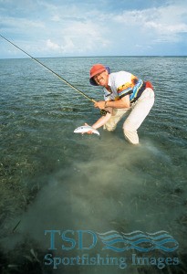 picture of a flyfisher with a bonefish caught with flyfishing gear in Mexico's Yucatan.